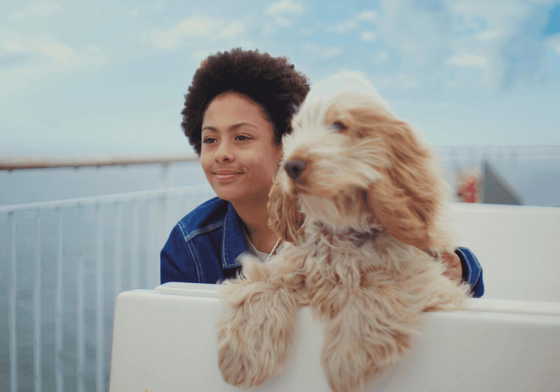 Girl with dog on ferry's sun deck